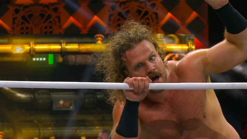 Screenshot from AEW Full Gear of "Hangman" Adam Page looking crazy